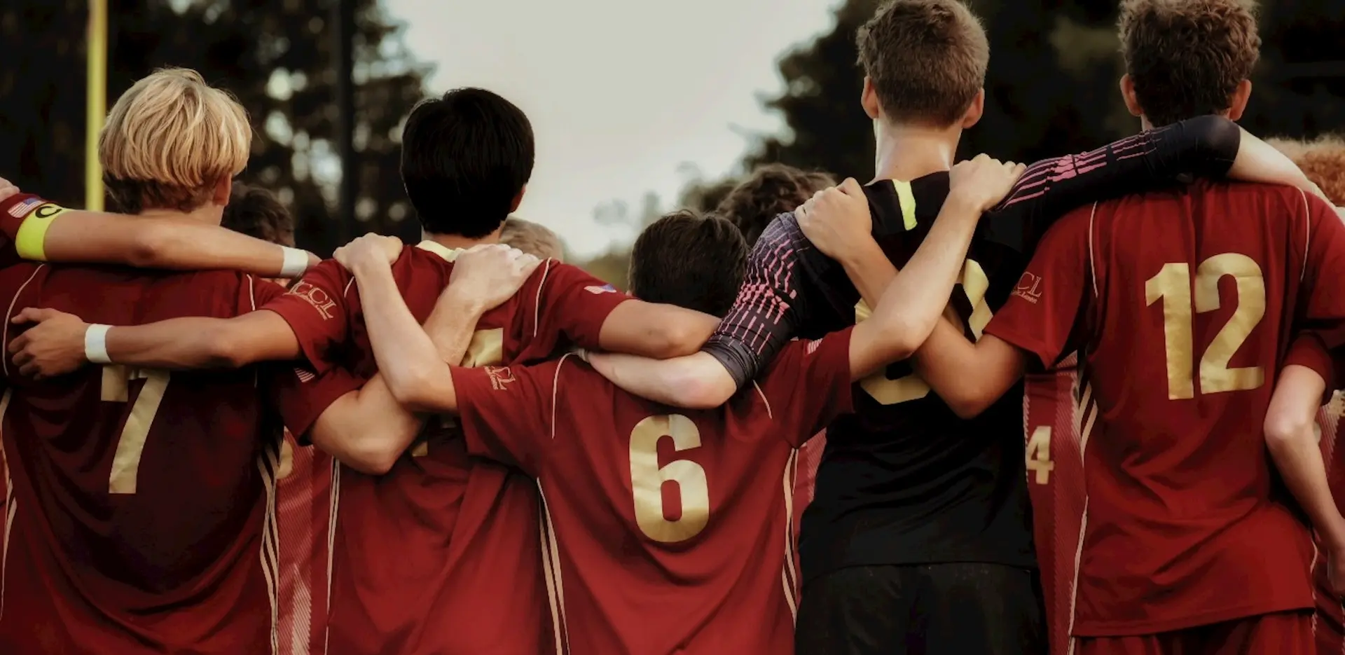 boys in red jersey shirts shows hormony and good social relations